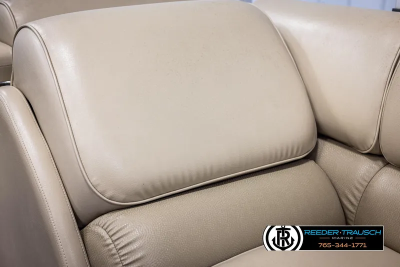 Slide: The Image of Beige leather seating on 2014 SunCatcher Elite 324 boat, Reeder-Trausch Marine logo visible. - 39