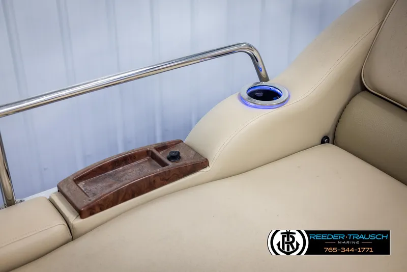 Slide: The Image of 2014 SunCatcher Elite 324 boat seat with cup holder and armrest. - 40