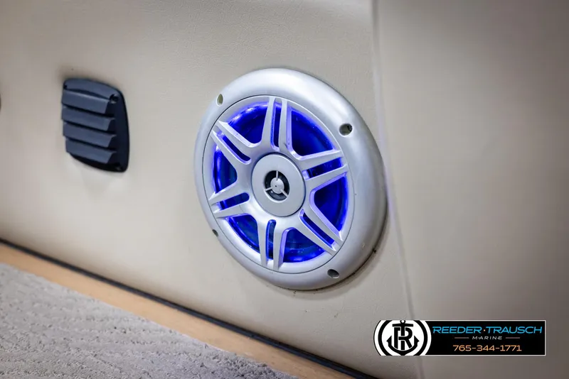Slide: The Image of Speaker with blue LED light on 2014 SunCatcher Elite 324 boat interior. - 42