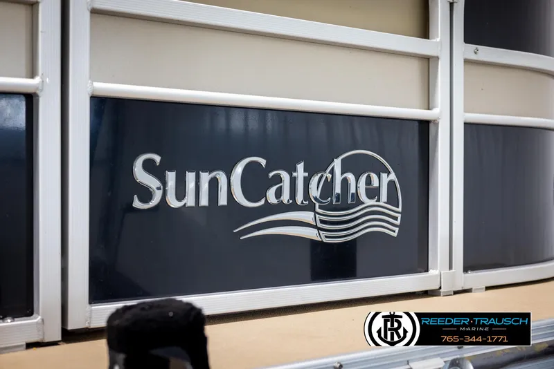 Slide: The Image of 2014 SunCatcher Elite 324 boat logo with Reeder-Trausch Marine branding. - 48