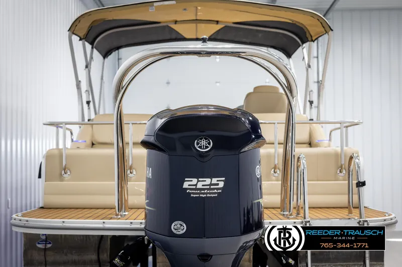 Slide: The Image of 2014 SunCatcher Elite 324 pontoon boat with Yamaha 225 engine, beige seating, and canopy. - 7