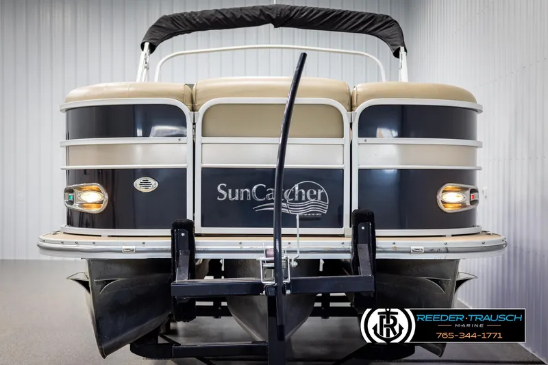 Slide: The Image of 2014 SunCatcher Elite 324 pontoon boat, rear view, displayed indoors. - 8