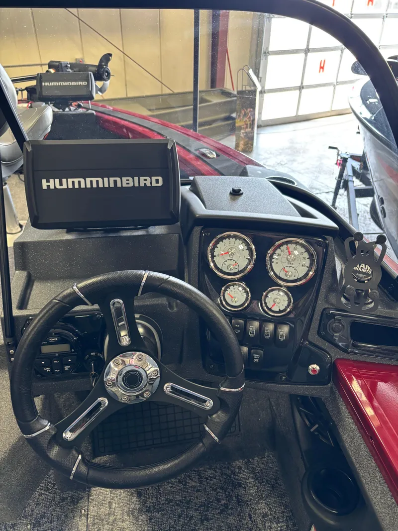 Slide: The Image of 2025 Tracker Targa V-19 Combo boat dashboard with Humminbird electronics and gauges. - 11