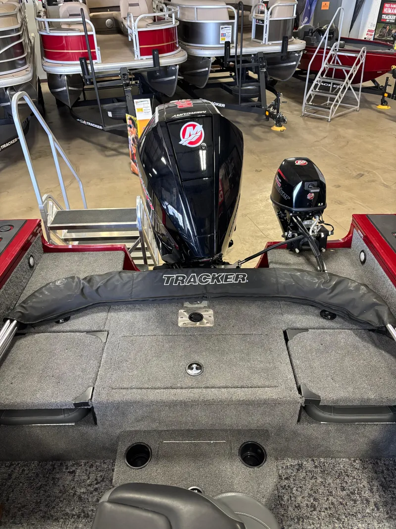Slide: The Image of 2025 Tracker Targa V-19 Combo boat with powerful engine in showroom. - 6