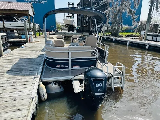 Slide: The Image of 2019 Sun Tracker Party Barge 20 DLX pontoon boat docked with 90 HP engine. - 3