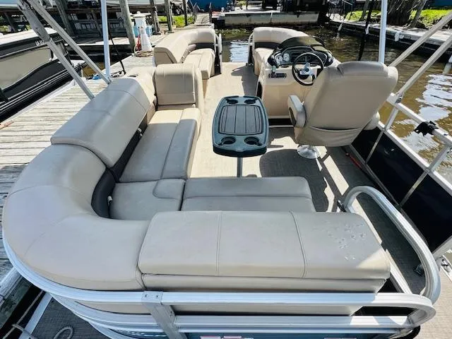 Slide: The Image of 2019 Sun Tracker Party Barge 20 DLX with spacious seating and steering console. - 4