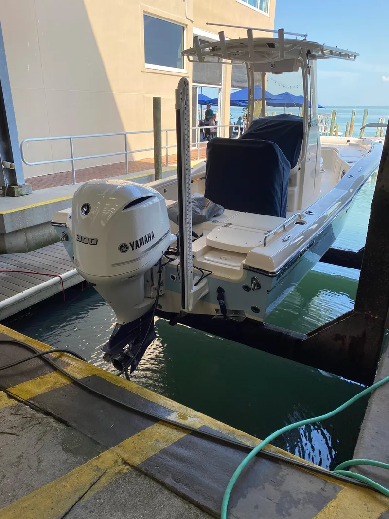 Slide: The Image of 2019 Grady-White 251 Coastal Explorer boat with Yamaha 300 engine at dockside. - 11