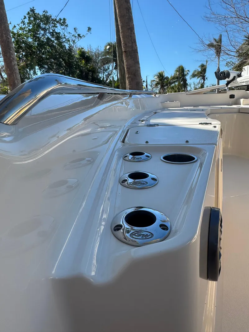 Slide: The Image of 2019 Grady-White 251 Coastal Explorer boat deck with cup holders and sleek design. - 16