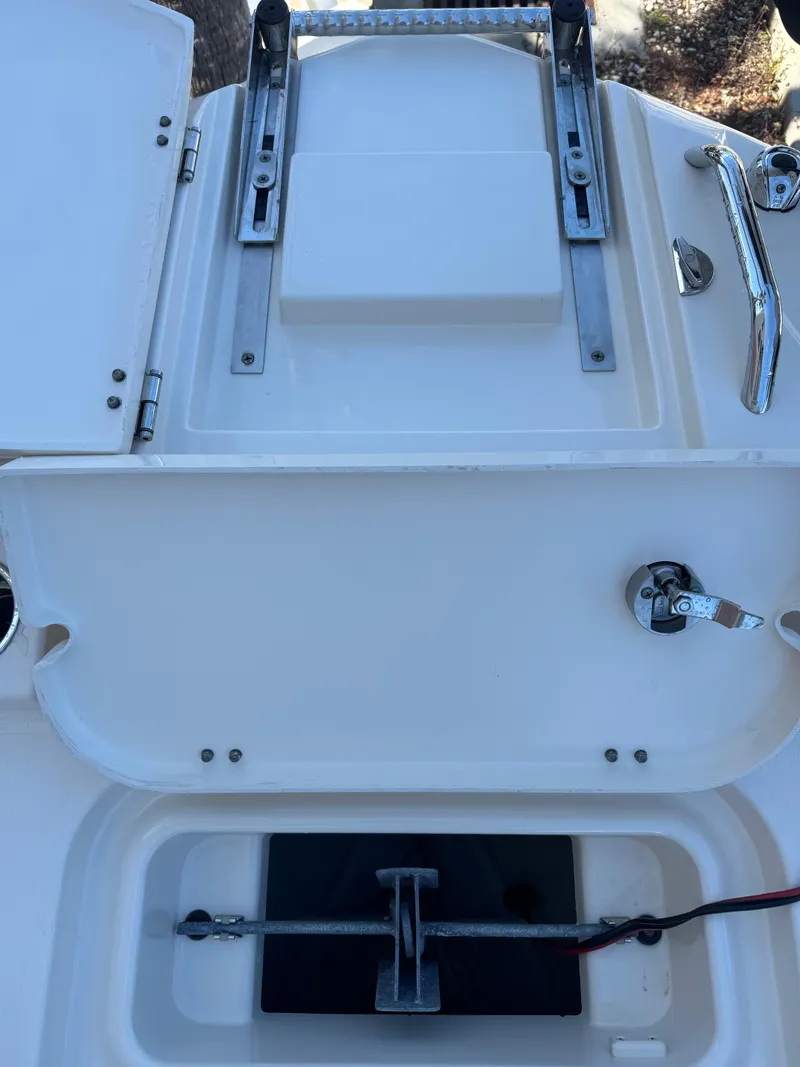 Slide: The Image of 2019 Grady-White 251 Coastal Explorer boat storage compartments and hardware. - 17