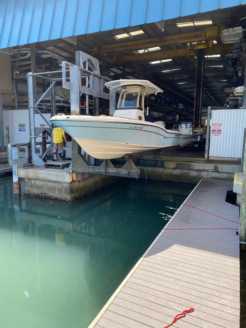 Slide: The Image of 2019 Grady-White 251 Coastal Explorer boat in a marina lift, ready for launch. - 19