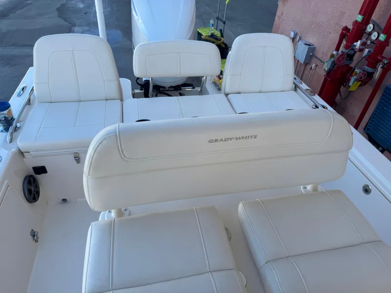 Slide: The Image of 2019 Grady-White 251 Coastal Explorer boat interior with white seating and backrest. - 24