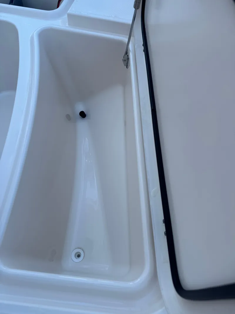 Slide: The Image of Open storage compartment on 2019 Grady-White 251 Coastal Explorer boat. - 25