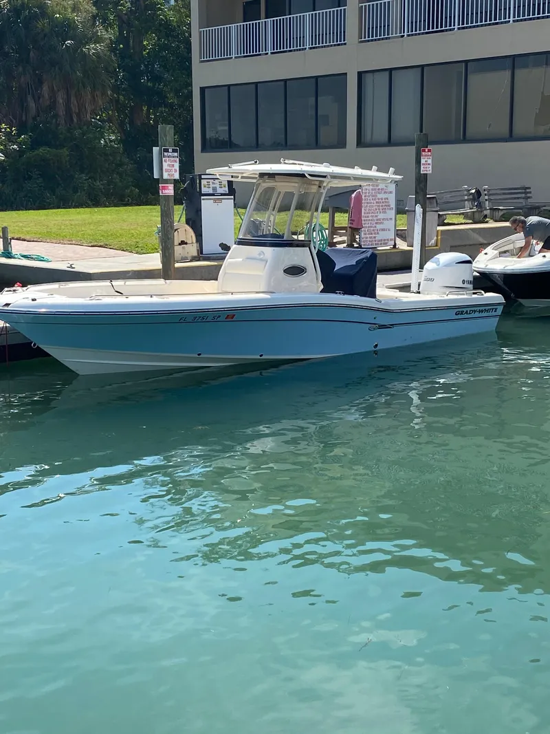 Slide: The Image of 2019 Grady-White 251 Coastal Explorer boat deck under clear blue sky. - 27