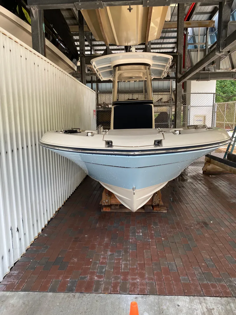 Slide: The Image of 2019 Grady-White 251 Coastal Explorer boat in storage, front view. - 28