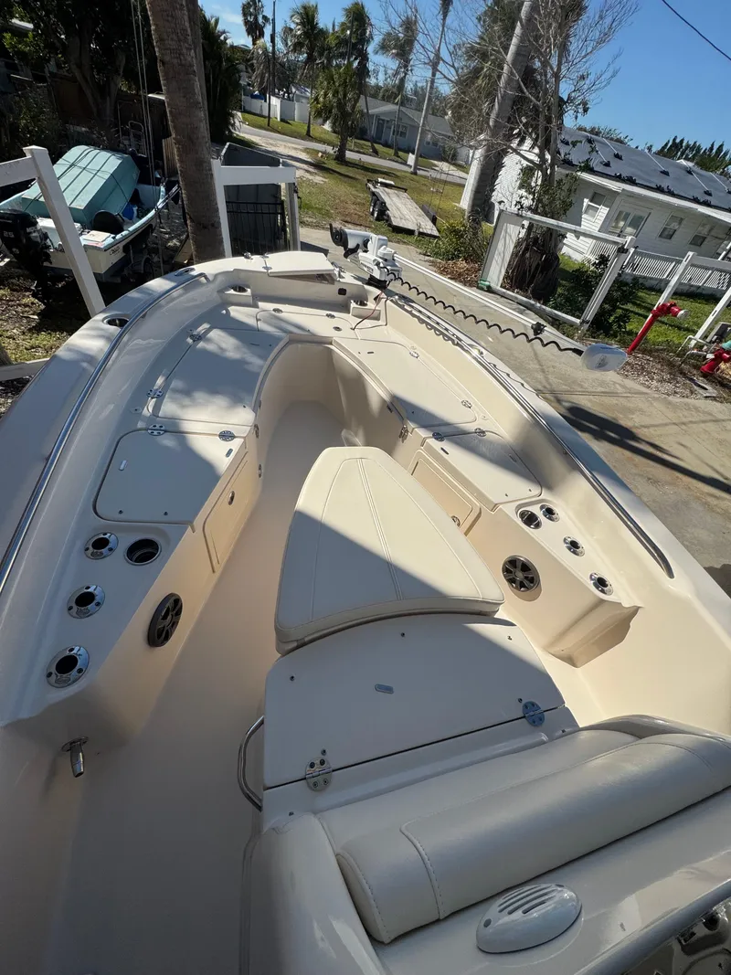 Slide: The Image of 2019 Grady-White 251 Coastal Explorer boat interior with seating and storage compartments. - 7