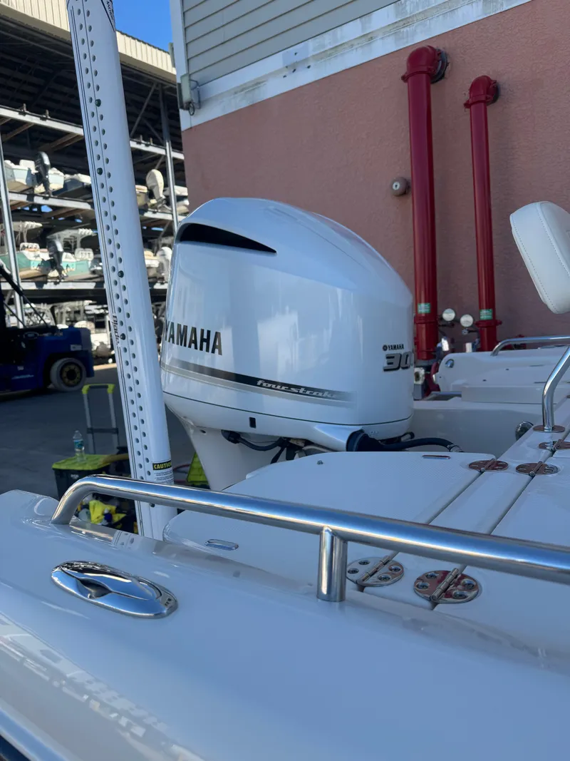 Slide: The Image of 2019 Grady-White 251 Coastal Explorer with Yamaha 300 outboard engine in marina setting. - 8