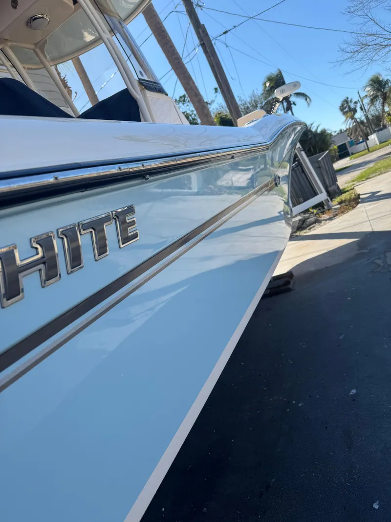 Slide: The Image of 2019 Grady-White 251 Coastal Explorer boat side view with logo. - 9
