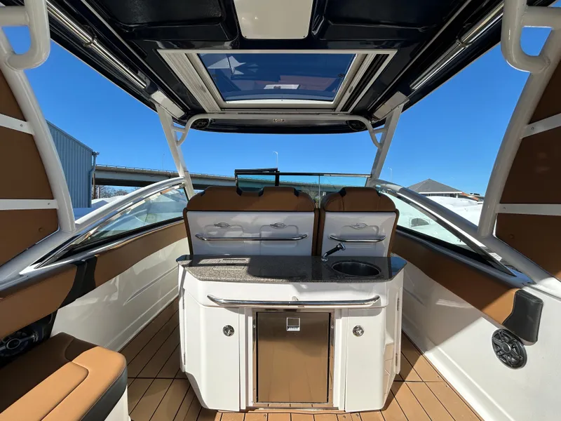 Slide: The Image of 2023 Chaparral 300 OSX boat interior with sleek design and modern amenities. - 9