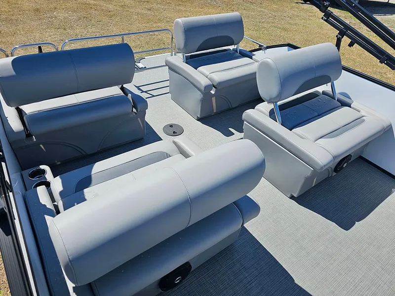 Slide: The Image of 2025 Bentley Pontoons LEGACY 243 QUAD SWINGBACK interior with gray seating arrangement. - 12