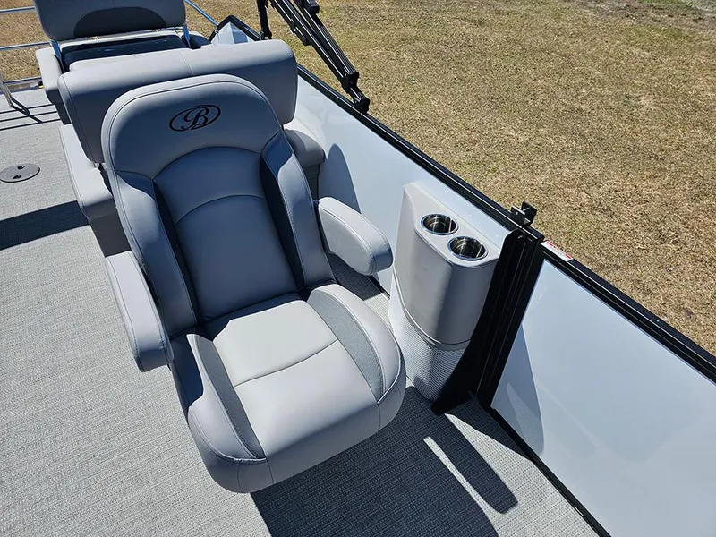 Slide: The Image of 2025 Bentley Pontoons LEGACY 243 QUAD SWINGBACK with luxurious seating and cup holders. - 16