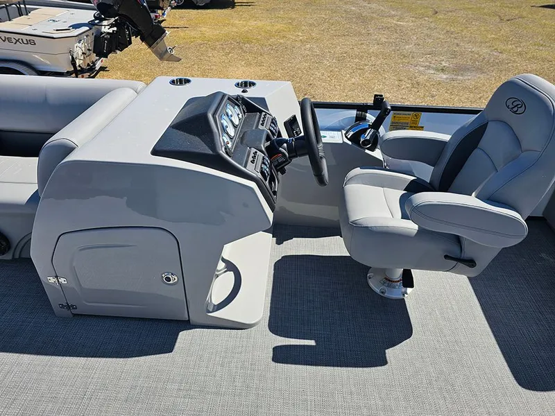 Slide: The Image of 2025 Bentley Pontoons LEGACY 243 QUAD SWINGBACK interior with modern helm and comfortable seating. - 17
