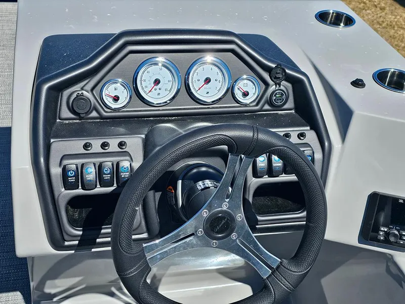 Slide: The Image of 2025 Bentley Pontoons LEGACY 243 QUAD SWINGBACK dashboard with steering wheel and gauges. - 18