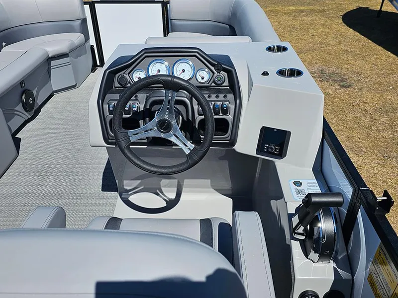Slide: The Image of 2025 Bentley Pontoons LEGACY 243 QUAD SWINGBACK dashboard with steering wheel and controls. - 20