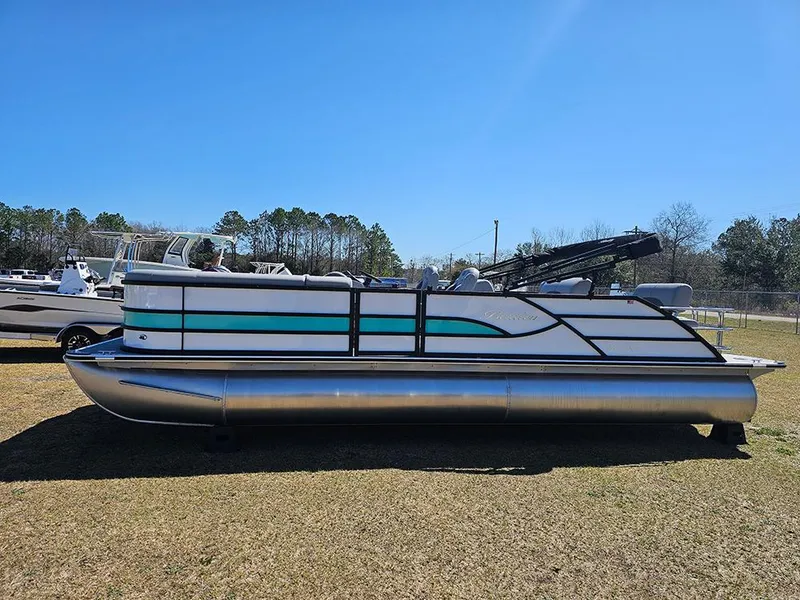 Slide: The Image of 2025 Bentley Pontoons LEGACY 243 QUAD SWINGBACK on grass under clear blue sky. - 6