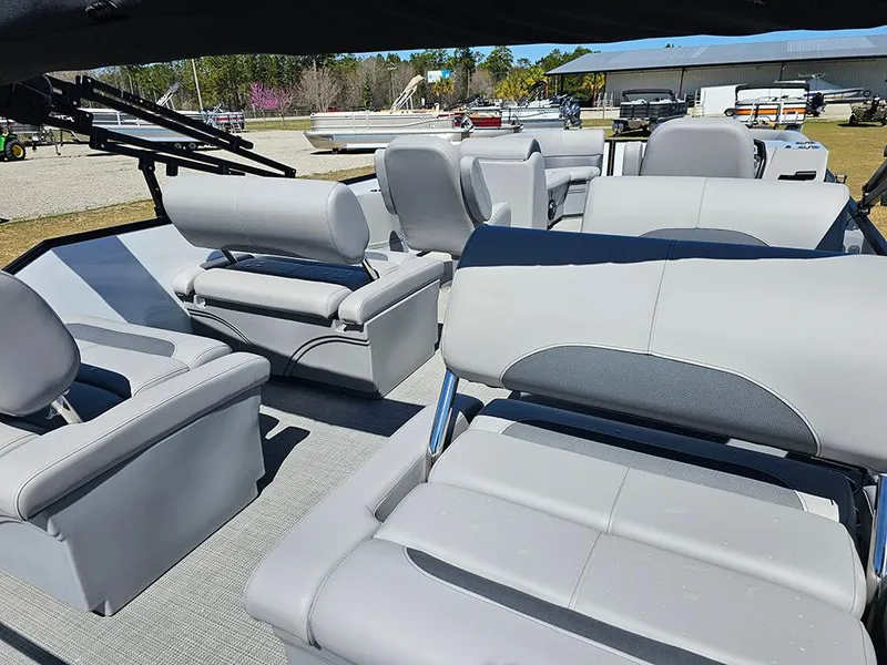 Slide: The Image of 2025 Bentley Pontoons LEGACY 243 QUAD SWINGBACK interior with luxurious seating and modern design. - 9