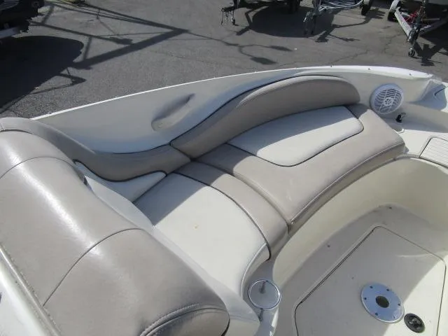 Slide: The Image of 2004 Sea Ray 270 Sundeck interior seating with beige upholstery. - 12