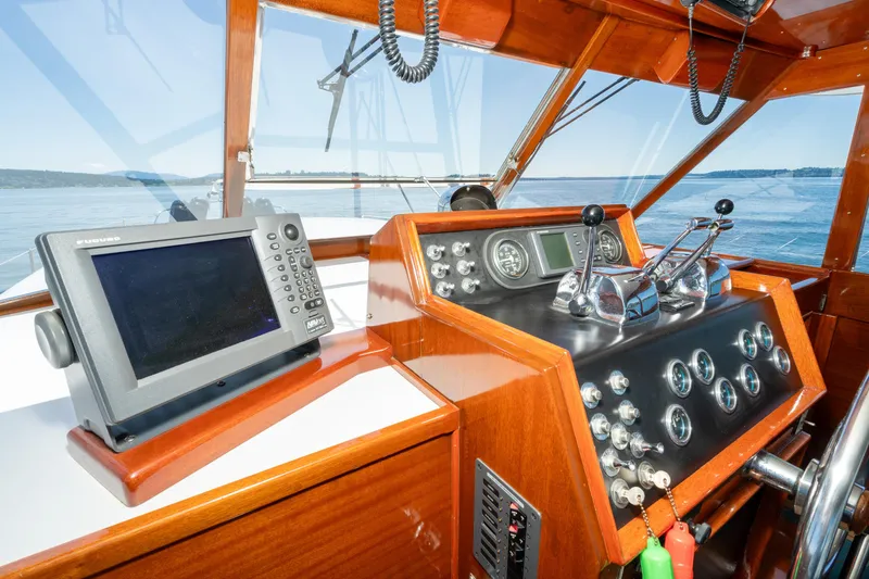 Slide: The Image of Helm of 1965 Chris-Craft 57 Constellation with navigation equipment and controls. - 16