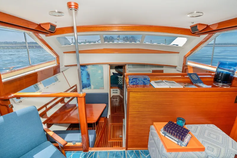 Slide: The Image of Interior of a 1965 Chris-Craft 57 Constellation yacht with wood finishes and seating area. - 26