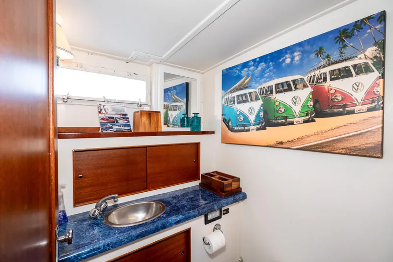 Slide: The Image of Bathroom interior of 1965 Chris-Craft 57 Constellation with vibrant van artwork. - 40