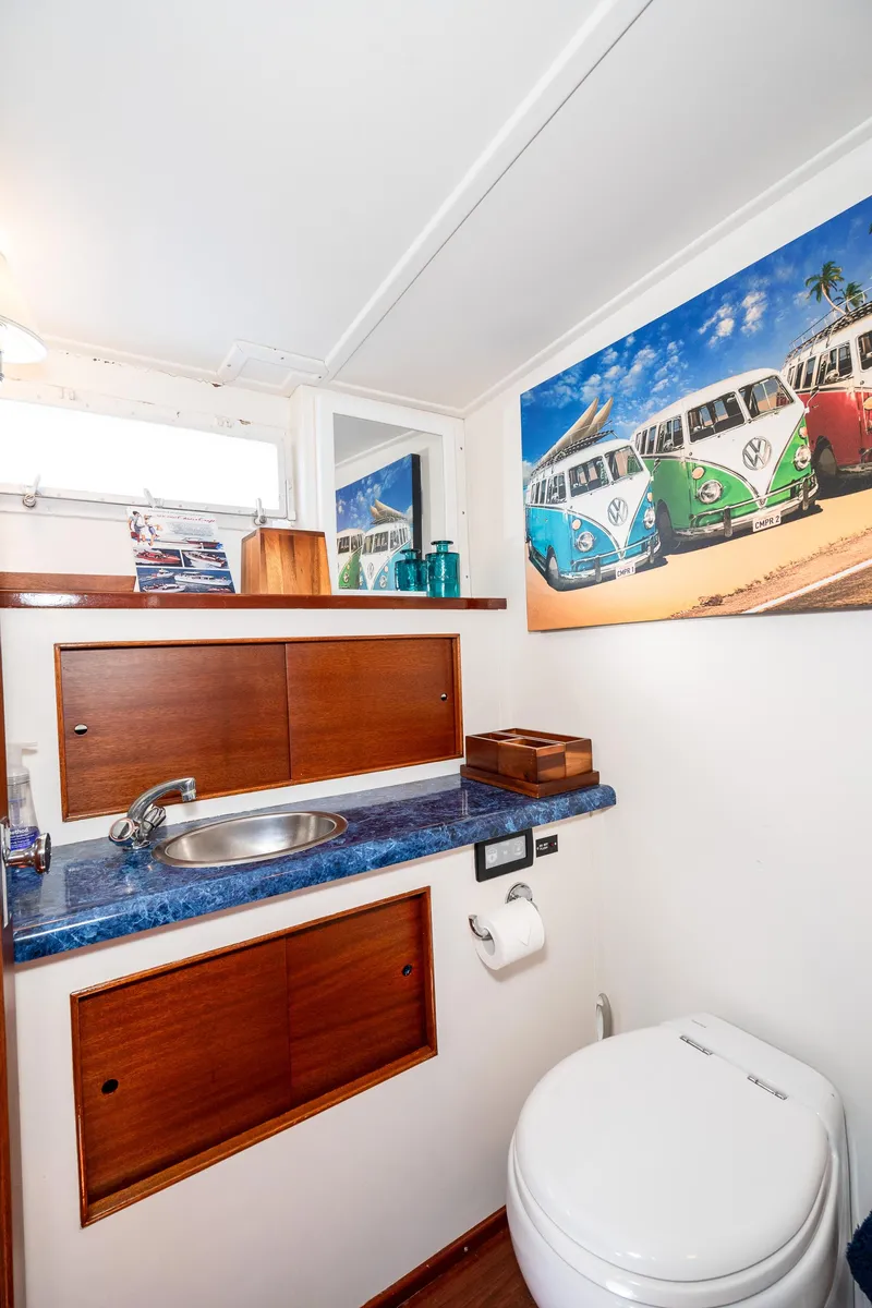 Slide: The Image of Bathroom interior of 1965 Chris-Craft 57 Constellation with vibrant wall art. - 41