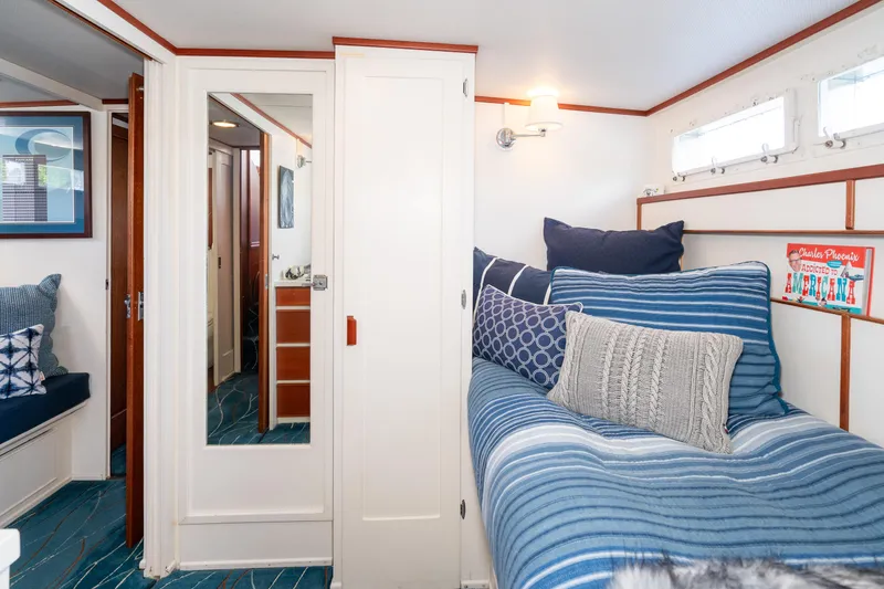 Slide: The Image of Cozy cabin interior of 1965 Chris-Craft 57 Constellation with blue and white decor. - 48