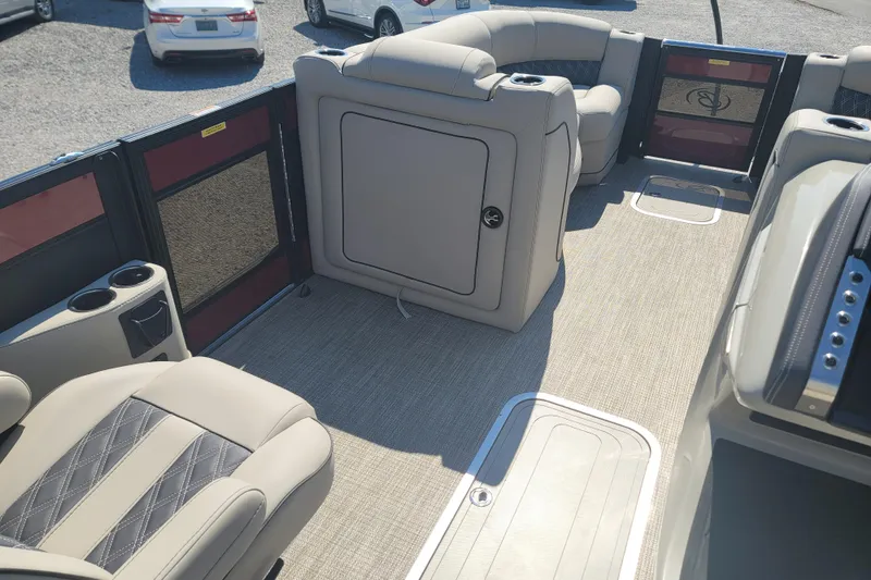 Slide: The Image of 2022 Barletta L23UC pontoon boat interior with plush seating and cup holders. - 21