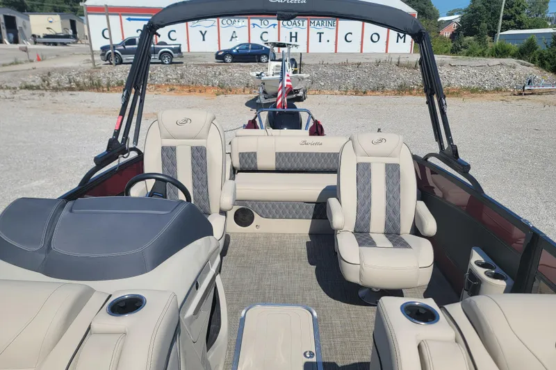 Slide: The Image of 2022 Barletta L23UC pontoon boat interior with plush seating and modern design. - 22