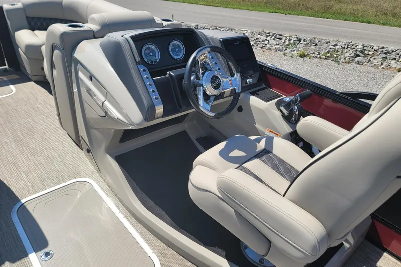 Slide: The Image of 2022 Barletta L23UC boat interior with modern dashboard and comfortable seating. - 23