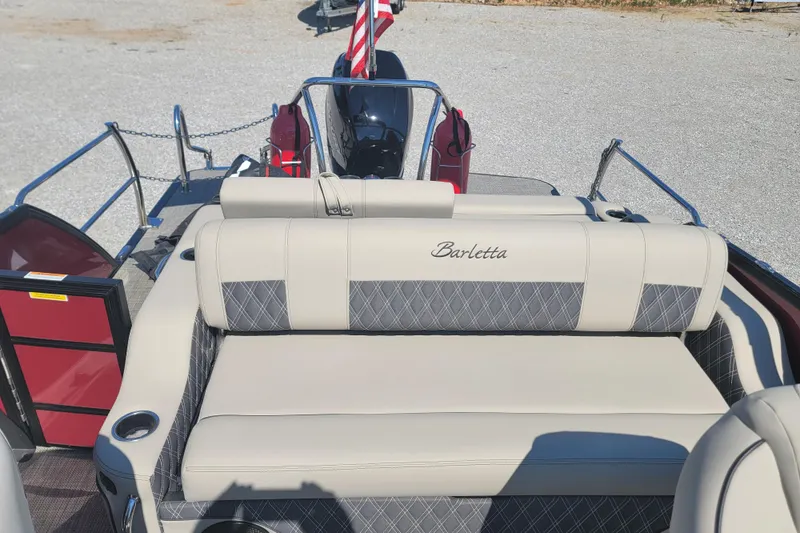 Slide: The Image of 2022 Barletta L23UC pontoon boat with beige seating and elegant design. - 25