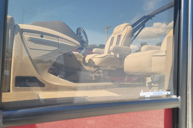 Slide: The Image of Interior view of 2022 Barletta L23UC pontoon boat through mesh screen. - 3