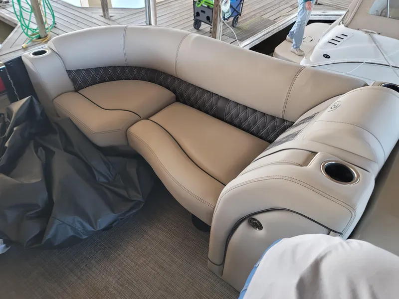 Slide: The Image of Luxurious seating on 2022 Barletta L23UC pontoon boat with elegant upholstery and cup holders. - 39