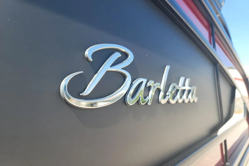 Slide: The Image of Close-up of 2022 Barletta L23UC logo on boat exterior. - 4