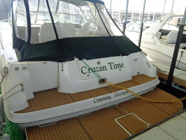 Slide: The Image of 1999 Sea Ray 400 Sundancer docked, named "Cruzan Time," located in Cumming, Georgia. - 27