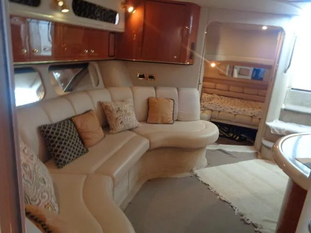 Slide: The Image of Luxurious interior of 1999 Sea Ray 400 Sundancer yacht with plush seating and elegant decor. - 7