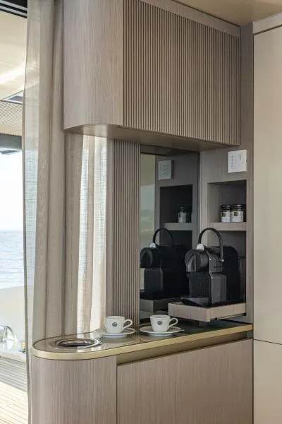 Slide: The Image of Modern coffee station on 2025 Absolute 70 Navetta yacht with ocean view. - 10