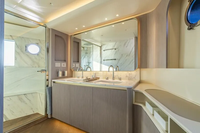Slide: The Image of Luxurious bathroom in 2025 Absolute 70 Navetta yacht with dual sinks and modern design. - 17