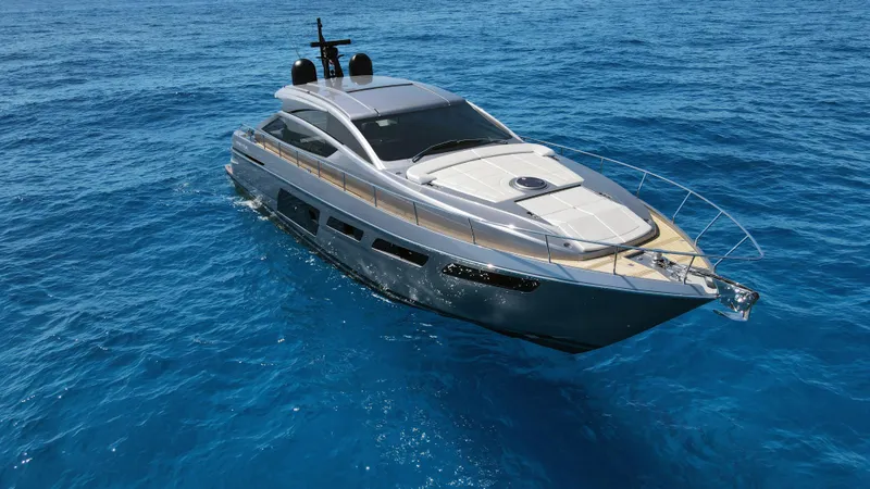 Slide: The Image of 2022 Pershing 6X yacht cruising on clear blue ocean waters. - 10