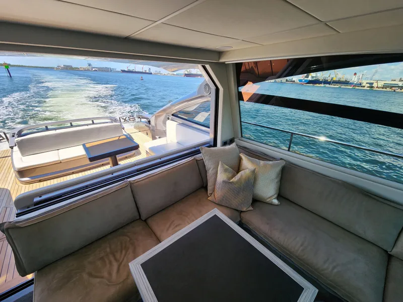Slide: The Image of Interior view of 2022 Pershing 6X yacht with ocean backdrop. - 16