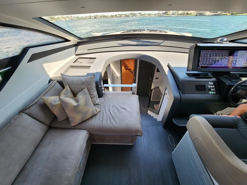 Slide: The Image of Interior of 2022 Pershing 6X yacht with modern seating and navigation controls. - 17