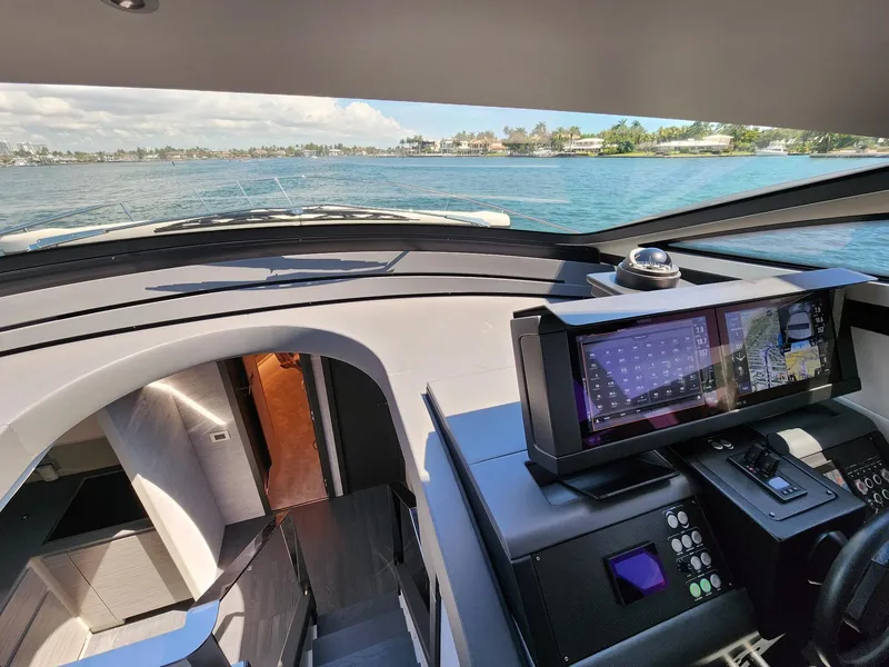 Slide: The Image of Interior view of 2022 Pershing 6X yacht cockpit with navigation system. - 18